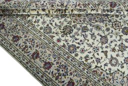 Close-up detail of 2000s Kashan rug from Iran / Persia showing Wool weave