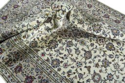 Surface texture of 2000s Kashan rug with natural Wool and intricate pattern