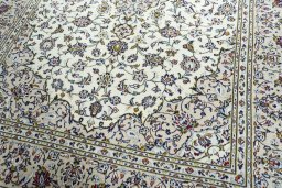 Close-up detail of 2000s Kashan rug from Iran / Persia showing Wool weave