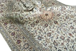 Surface texture of 2000s Kashan rug with natural Wool and intricate pattern