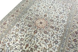 Backside of handmade 2000s Kashan rug showing knot structure and weave density