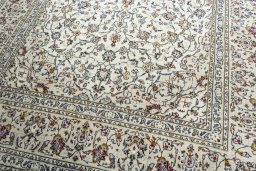Close-up detail of 2000s Kashan rug from Iran / Persia showing Wool weave