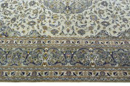 Corner detail of 2000s Kashan rug showing border pattern and Wool pile