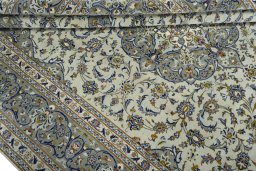Close-up detail of 2000s Kashan rug from Iran / Persia showing Wool weave