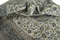 Surface texture of 2000s Kashan rug with natural Wool and intricate pattern