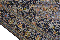 Close-up detail of 2000s Kashan rug from Iran / Persia showing Wool weave