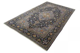 Corner detail of 2000s Kashan rug showing border pattern and Wool pile