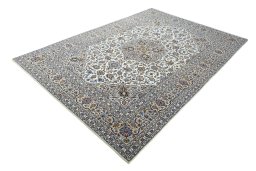 Corner detail of 2000s Kashan rug showing border pattern and Wool pile