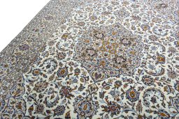 Backside of handmade 2000s Kashan rug showing knot structure and weave density