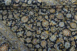 Close-up detail of 2000s Kashan rug from Iran / Persia showing Wool weave