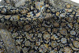 Surface texture of 2000s Kashan rug with natural Wool and intricate pattern