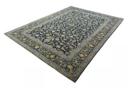 Corner detail of 2000s Kashan rug showing border pattern and Wool pile