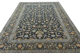 Surface texture of 2000s Kashan rug with natural Wool and intricate pattern