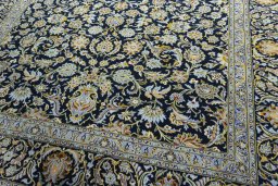 Close-up detail of 2000s Kashan rug from Iran / Persia showing Wool weave