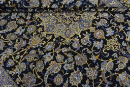 Close-up detail of 2000s Kashan rug from Iran / Persia showing Wool weave
