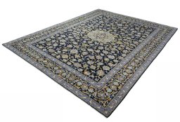 Corner detail of 2000s Kashan rug showing border pattern and Wool pile