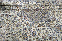 Close-up detail of 2000s Kashan rug from Iran / Persia showing Wool weave