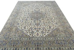 Surface texture of 2000s Kashan rug with natural Wool and intricate pattern