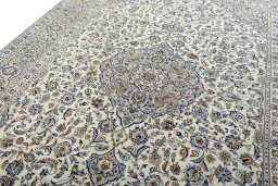 Backside of handmade 2000s Kashan rug showing knot structure and weave density