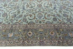 Corner detail of 1970s Kashan rug showing border pattern and Wool pile