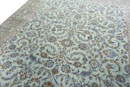 Backside of handmade 1970s Kashan rug showing knot structure and weave density