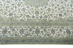 Corner detail of 2000s Kashan rug showing border pattern and Wool pile