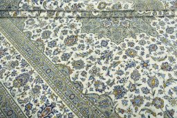 Close-up detail of 2000s Kashan rug from Iran / Persia showing Wool weave