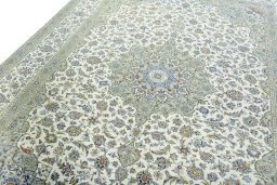 Backside of handmade 2000s Kashan rug showing knot structure and weave density