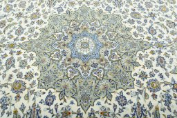 Central medallion detail of 2000s Kashan rug from Iran / Persia