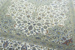 Close-up detail of 2000s Kashan rug from Iran / Persia showing Wool weave