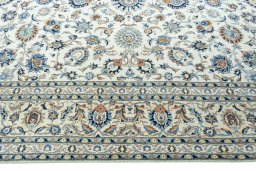 Corner detail of 2000s Kashan rug showing border pattern and Wool pile