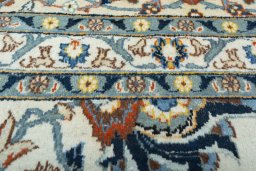 Backside of handmade 2000s Kashan rug showing knot structure and weave density