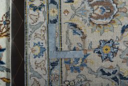 Close-up detail of 2000s Kashan rug from Iran / Persia showing Wool weave