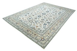 Corner detail of 2000s Kashan rug showing border pattern and Wool pile