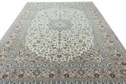 Surface texture of 2000s Kashan rug with natural Wool and intricate pattern