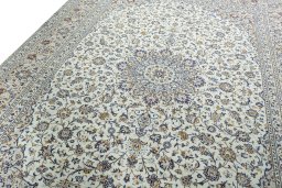 Backside of handmade 2000s Kashan rug showing knot structure and weave density