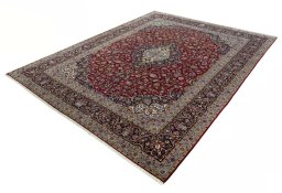 Corner detail of New Kashan rug showing border pattern and Wool pile