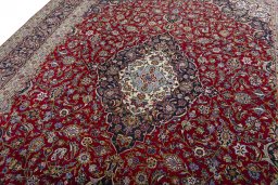 Backside of handmade New Kashan rug showing knot structure and weave density