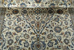 Close-up detail of 2000s Kashan rug from Iran / Persia showing Wool weave