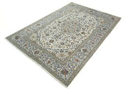 Corner detail of 2000s Kashan rug showing border pattern and Wool pile