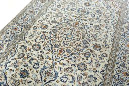 Backside of handmade 2000s Kashan rug showing knot structure and weave density