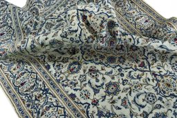 Surface texture of 2000s Kashan rug with natural Wool and intricate pattern