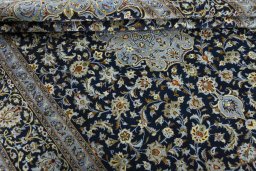 Close-up detail of 2000s Kashan rug from Iran / Persia showing Wool weave