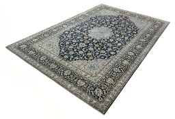 Corner detail of 2000s Kashan rug showing border pattern and Wool pile