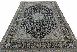 Surface texture of 2000s Kashan rug with natural Wool and intricate pattern