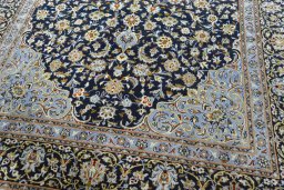 Close-up detail of 2000s Kashan rug from Iran / Persia showing Wool weave