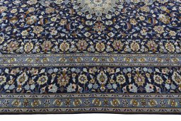 Corner detail of 2000s Kashan rug showing border pattern and Wool pile