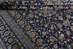 Close-up detail of 2000s Kashan rug from Iran / Persia showing Wool weave