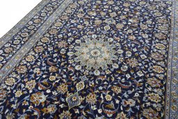 Backside of handmade 2000s Kashan rug showing knot structure and weave density