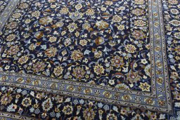 Close-up detail of 2000s Kashan rug from Iran / Persia showing Wool weave